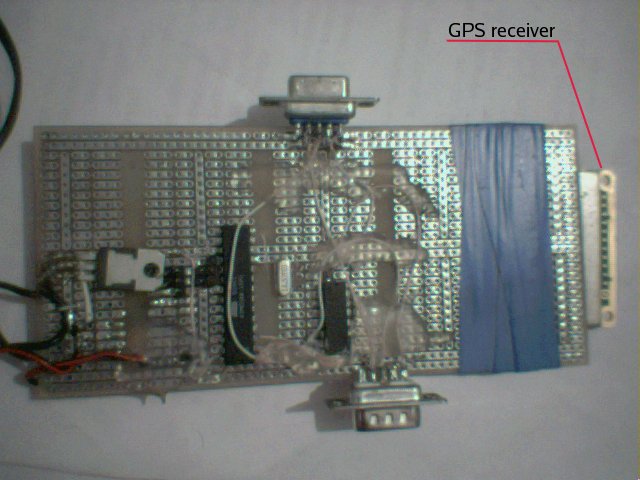 [GPS receiver tied to a board with a couple of IC]